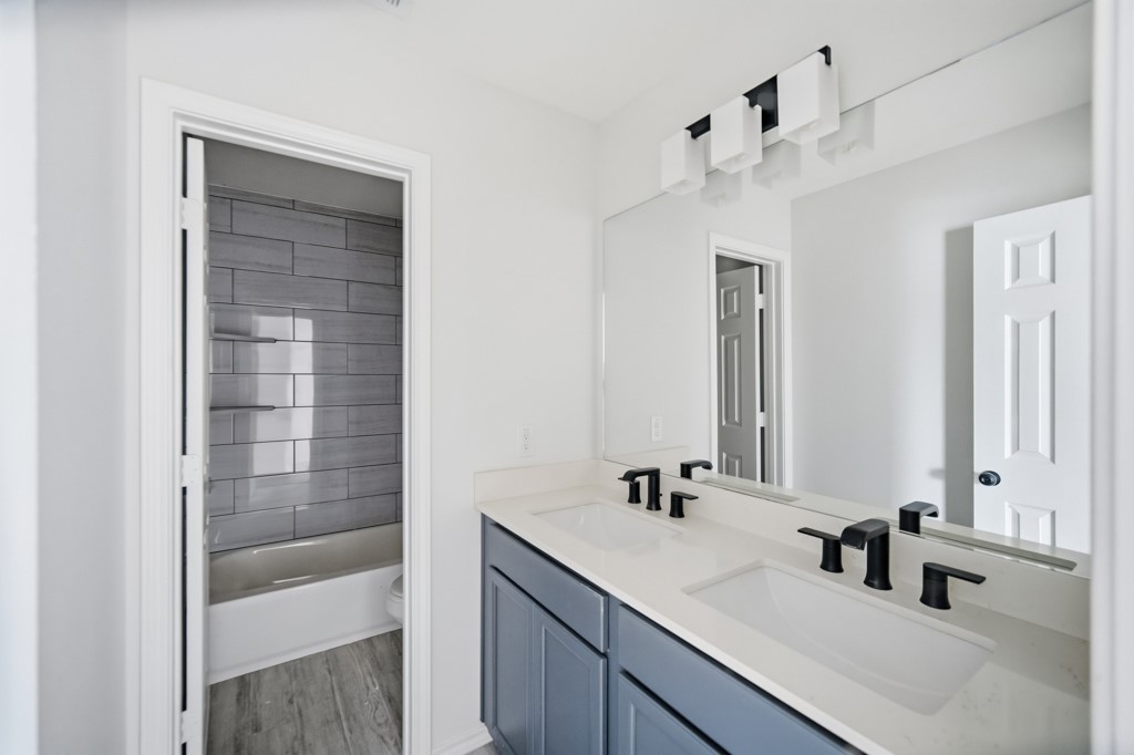16511 Boston Post Road Cypress, TX 77429 - Photo 33 of 46 a bathroom with a sink and a mirror