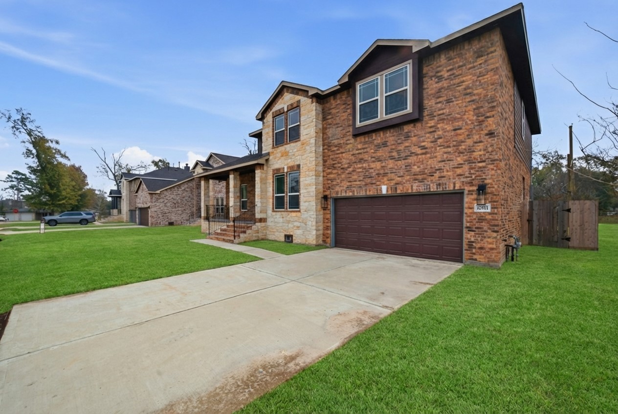 16511 Boston Post Road Cypress, TX 77429 - Photo 41 of 46 a brick house with a small yard and a large parking space