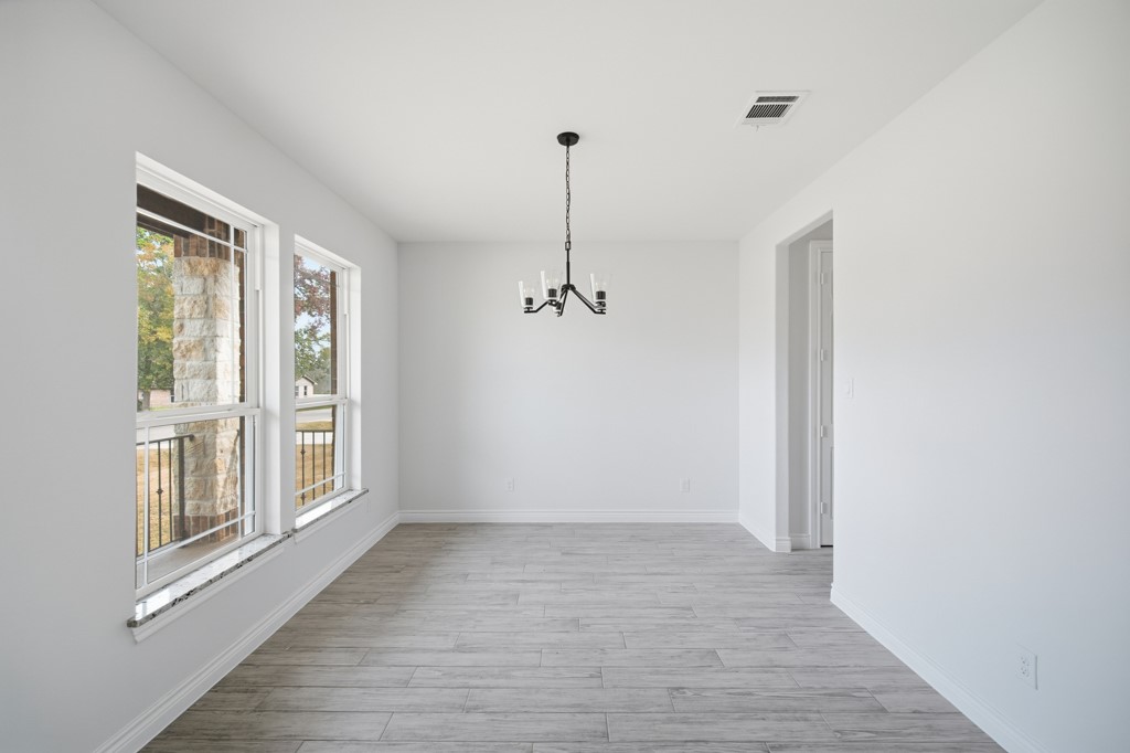 16511 Boston Post Road Cypress, TX 77429 - Photo 8 of 46 a view of a room with wooden floor ceiling fan and window