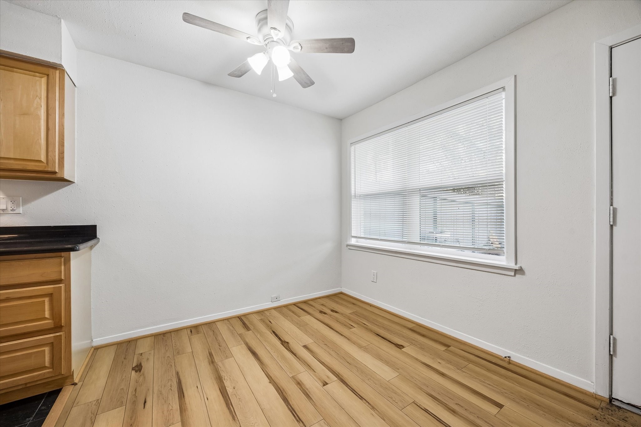 2206 Mason Street, Unit 7 Houston, TX 77006 - Photo 4 of 11 a view of empty room with wooden floor and fan