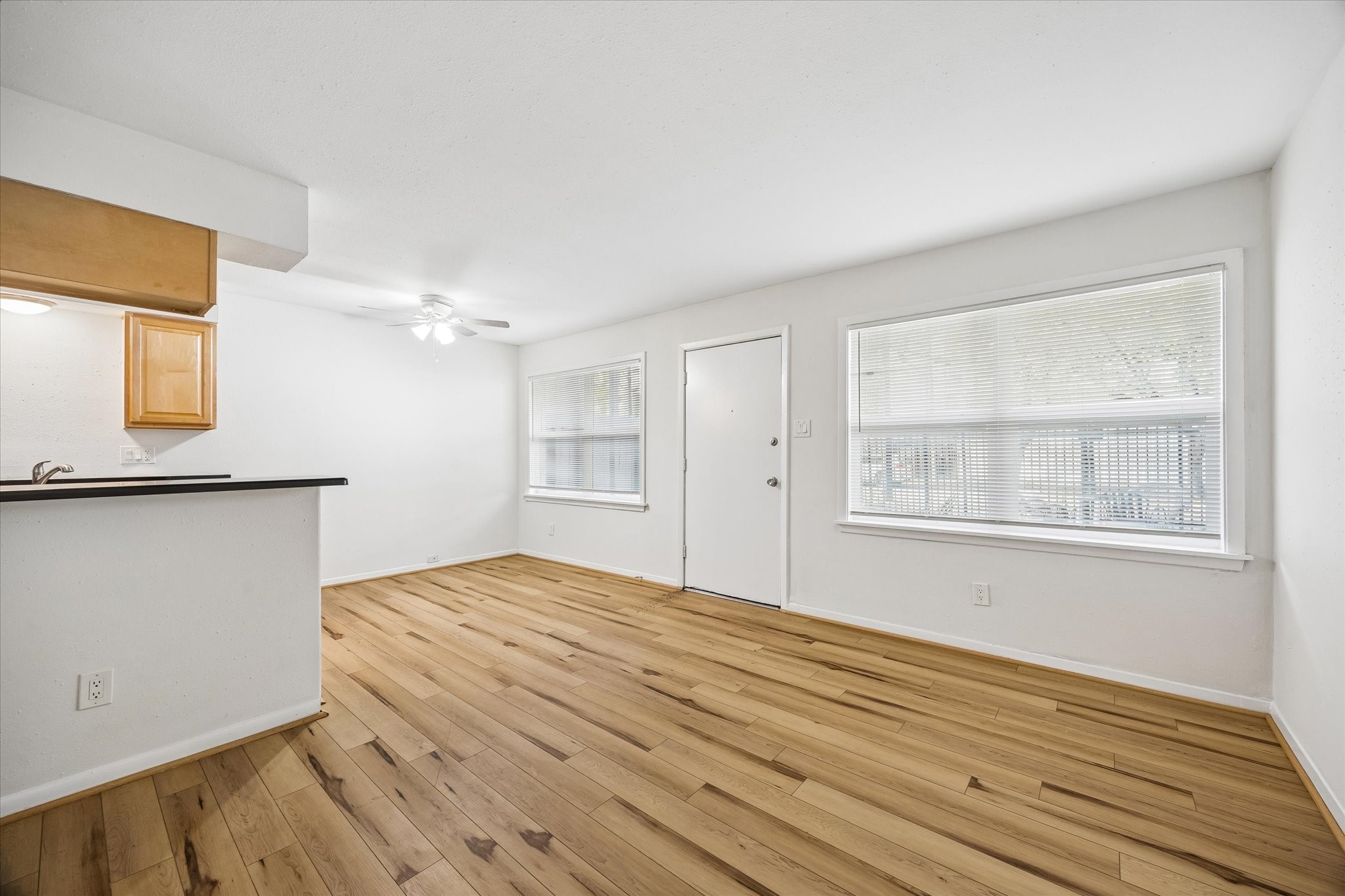 2206 Mason Street, Unit 7 Houston, TX 77006 - Photo 5 of 11 a view of empty room with wooden floor and fan