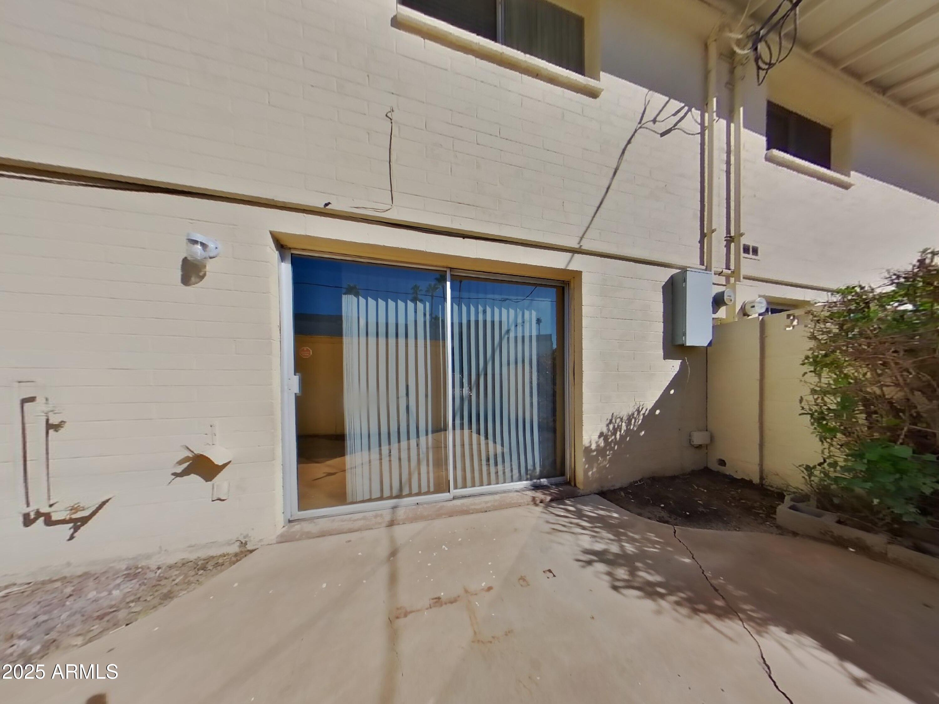 5025 South Mill Avenue Tempe, AZ 85282 - Photo 10 of 18 a view of a house with a wooden door