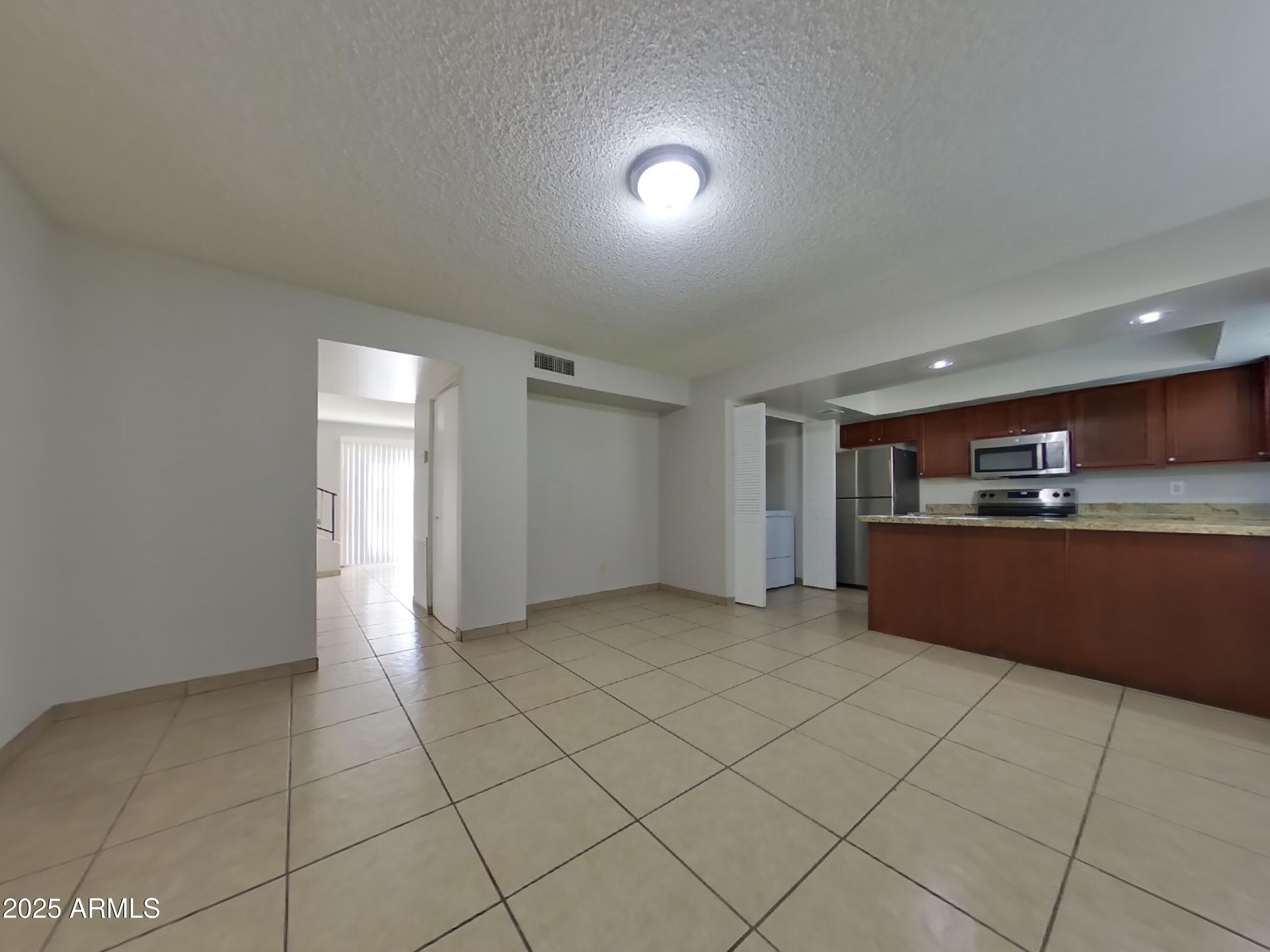 5025 South Mill Avenue Tempe, AZ 85282 - Photo 3 of 18 a view of kitchen with refrigerator and window