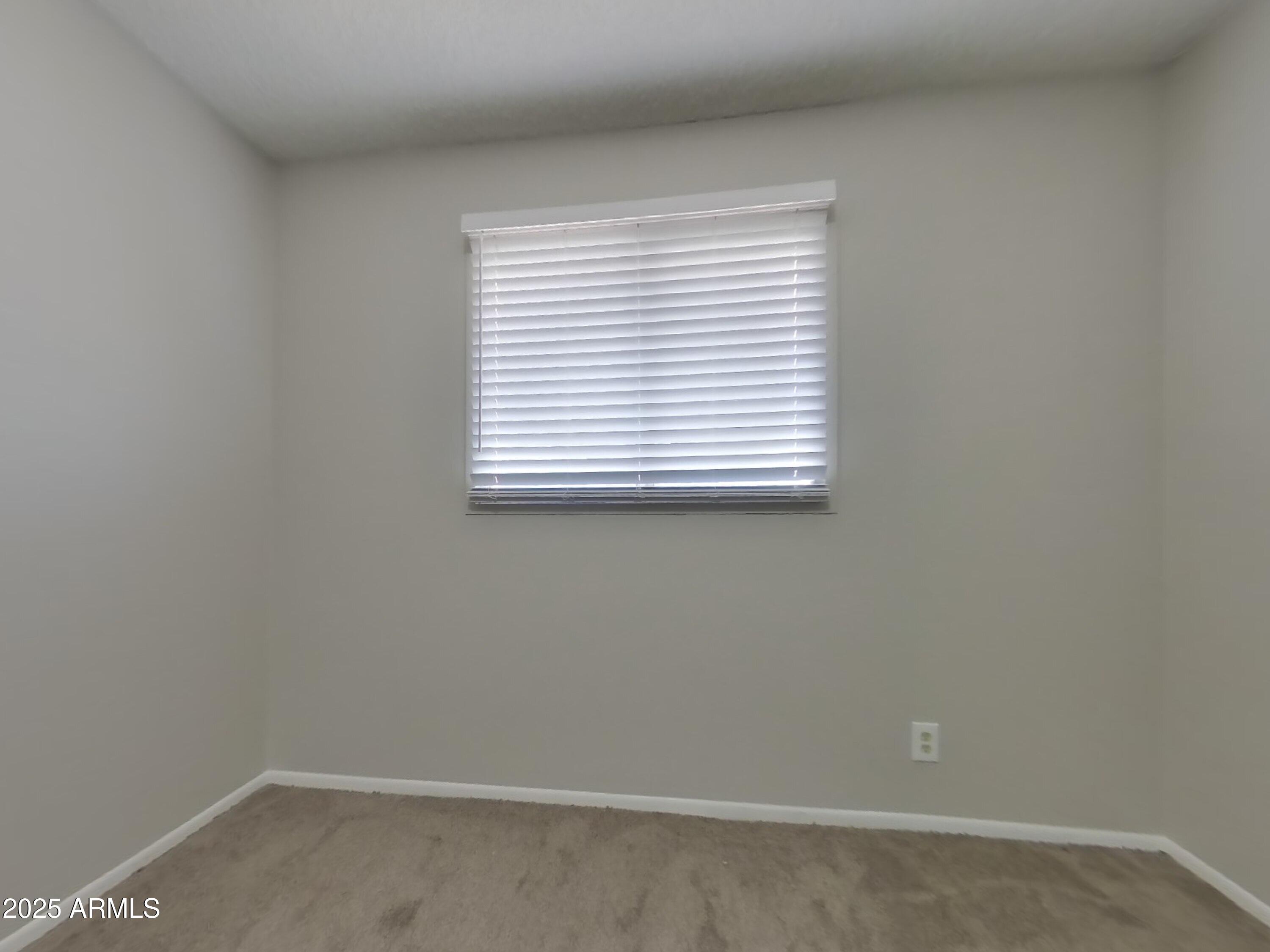 5025 South Mill Avenue Tempe, AZ 85282 - Photo 8 of 18 an empty room with a window