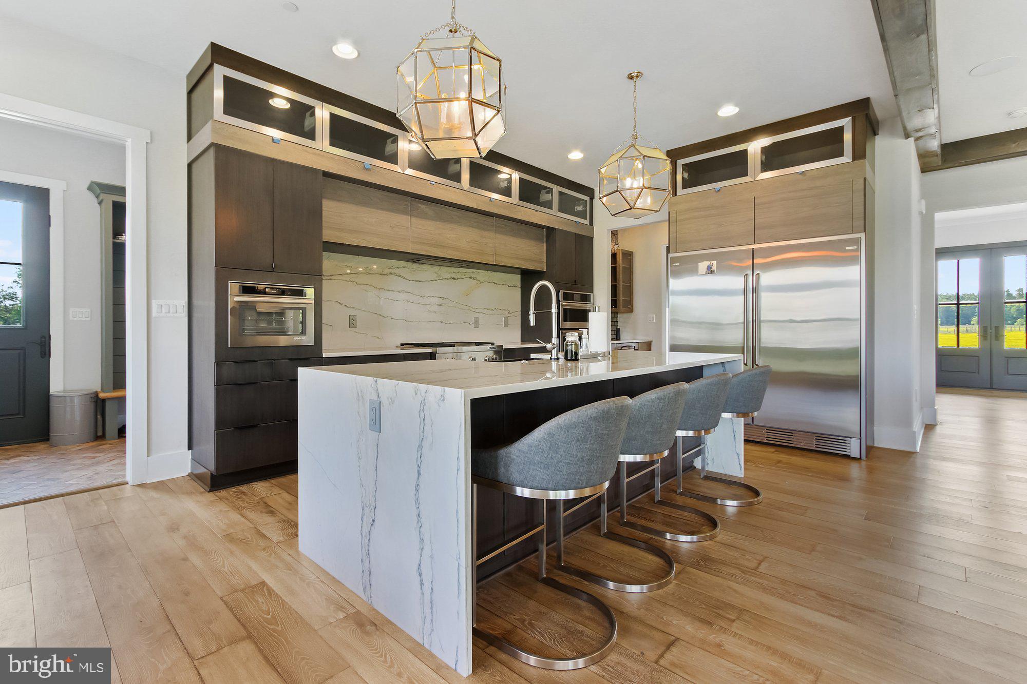 2033 Connolly Road Fallston, MD 21047 - Photo 14 of 49 a kitchen with kitchen island granite countertop wooden floor and stainless steel appliances
