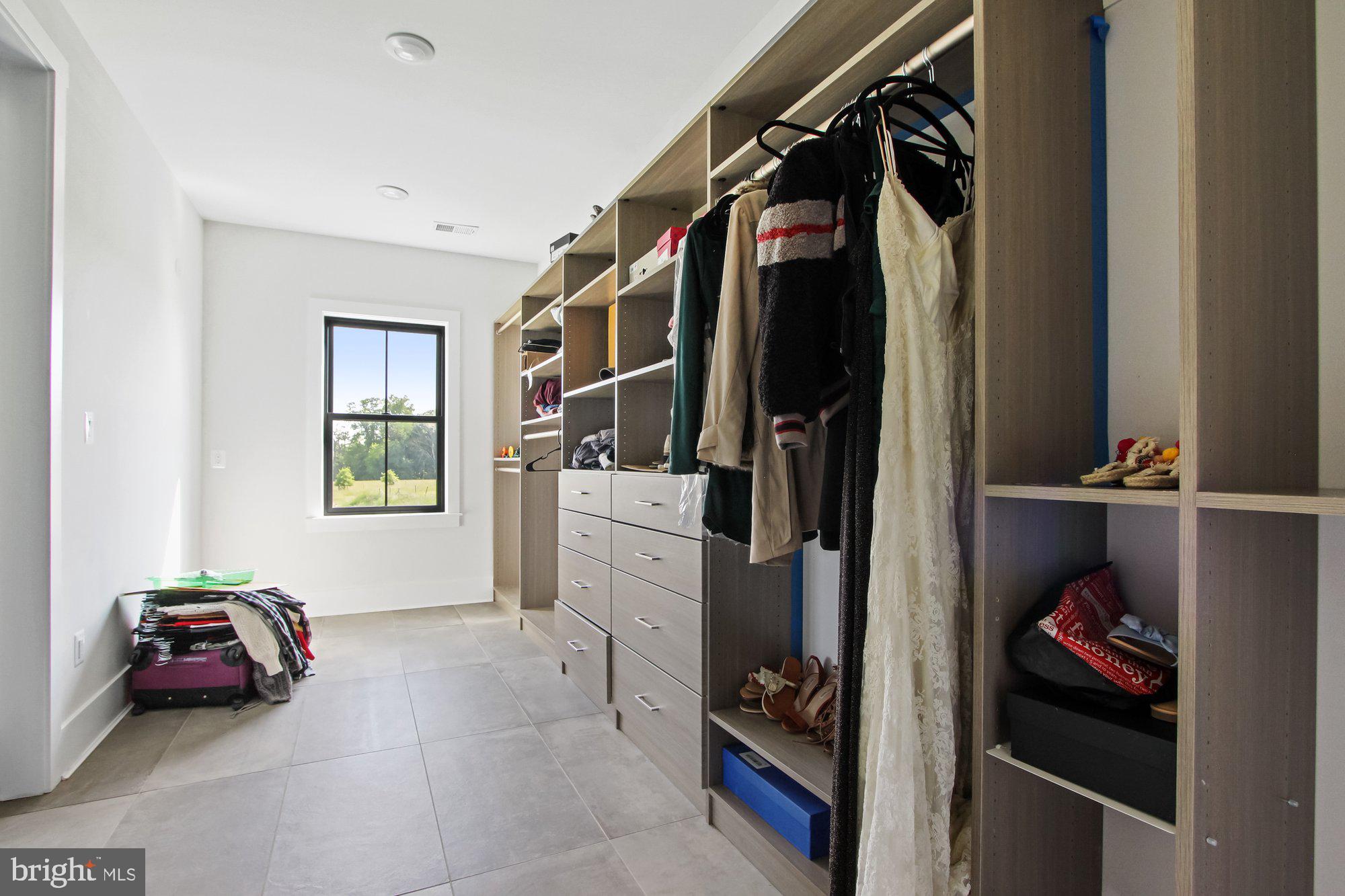 2033 Connolly Road Fallston, MD 21047 - Photo 33 of 49 a view of walk in closet with clothes and shoes