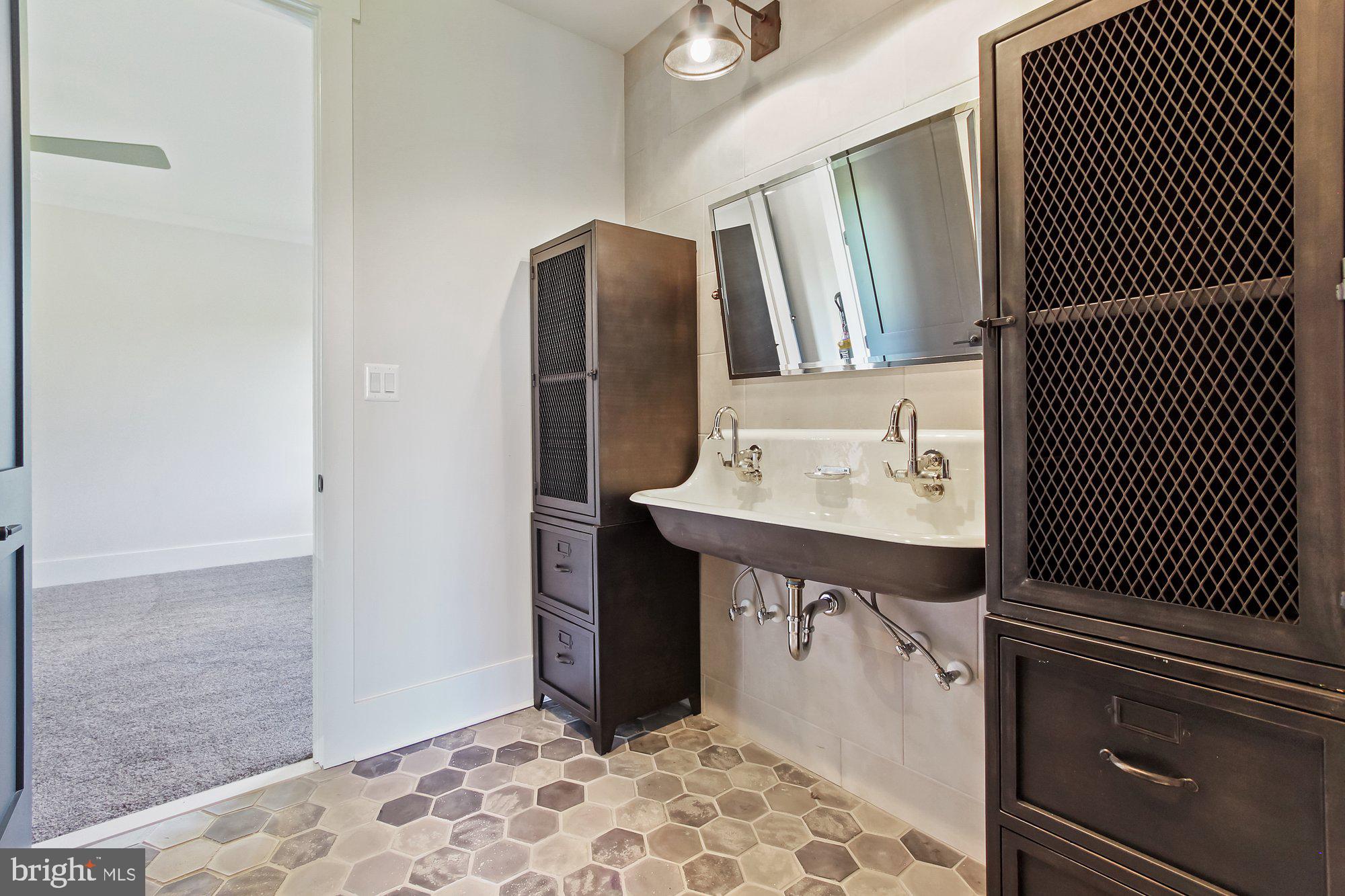 2033 Connolly Road Fallston, MD 21047 - Photo 38 of 49 a bathroom with a sink and a mirror