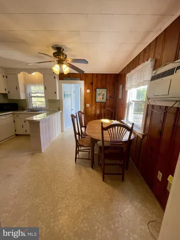 a bathroom with a sink mirror and vanity