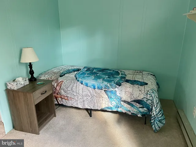 a bathroom with a sink toilet and mirror