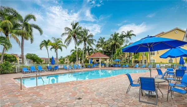 a view of house with outdoor space and swimming pool