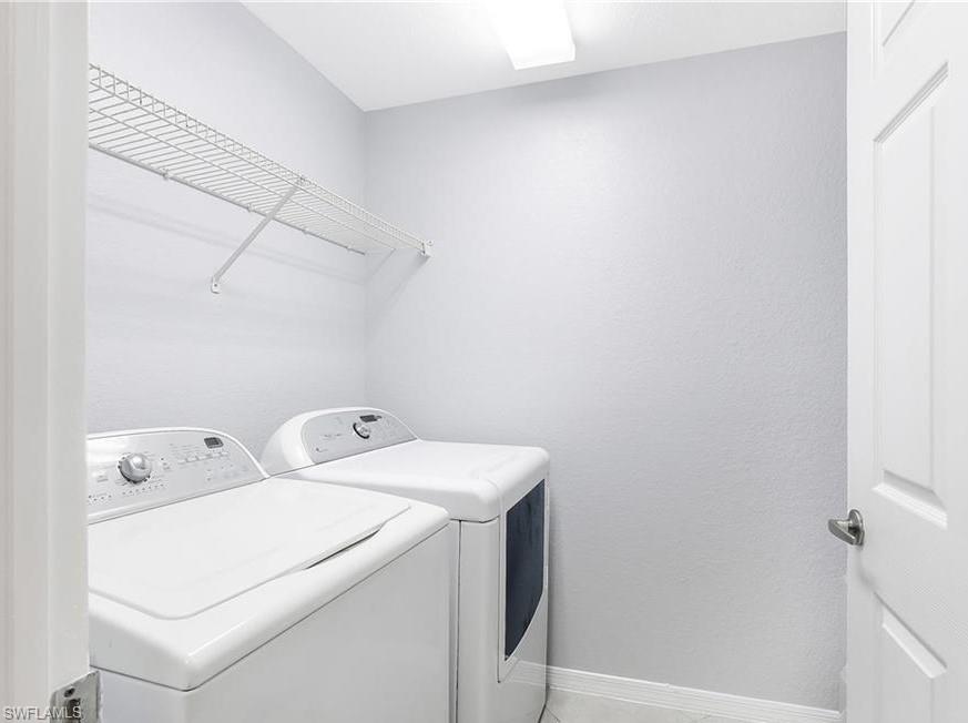 4635 St Croix Lane, Unit 1215 Naples, FL 34109 - Photo 12 of 22 a utility room with dryer and washer