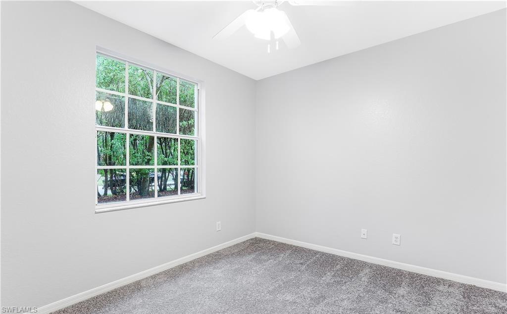 4635 St Croix Lane, Unit 1215 Naples, FL 34109 - Photo 14 of 22 an empty room with a window