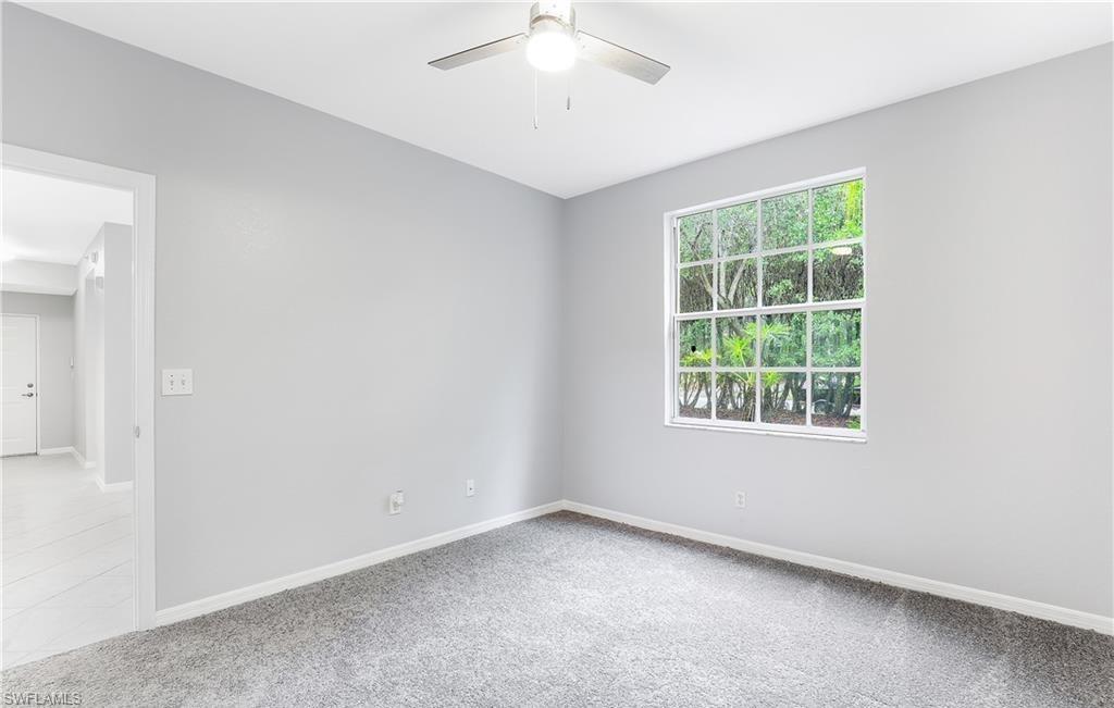 4635 St Croix Lane, Unit 1215 Naples, FL 34109 - Photo 15 of 22 an empty room with a window