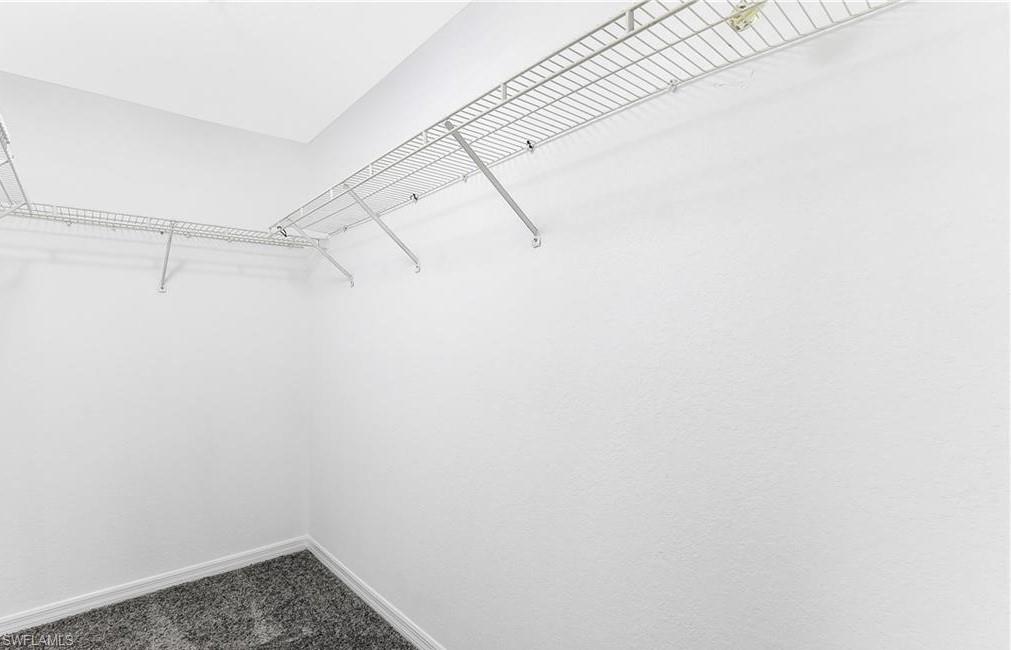 4635 St Croix Lane, Unit 1215 Naples, FL 34109 - Photo 17 of 22 a view of a room with racks on the wall