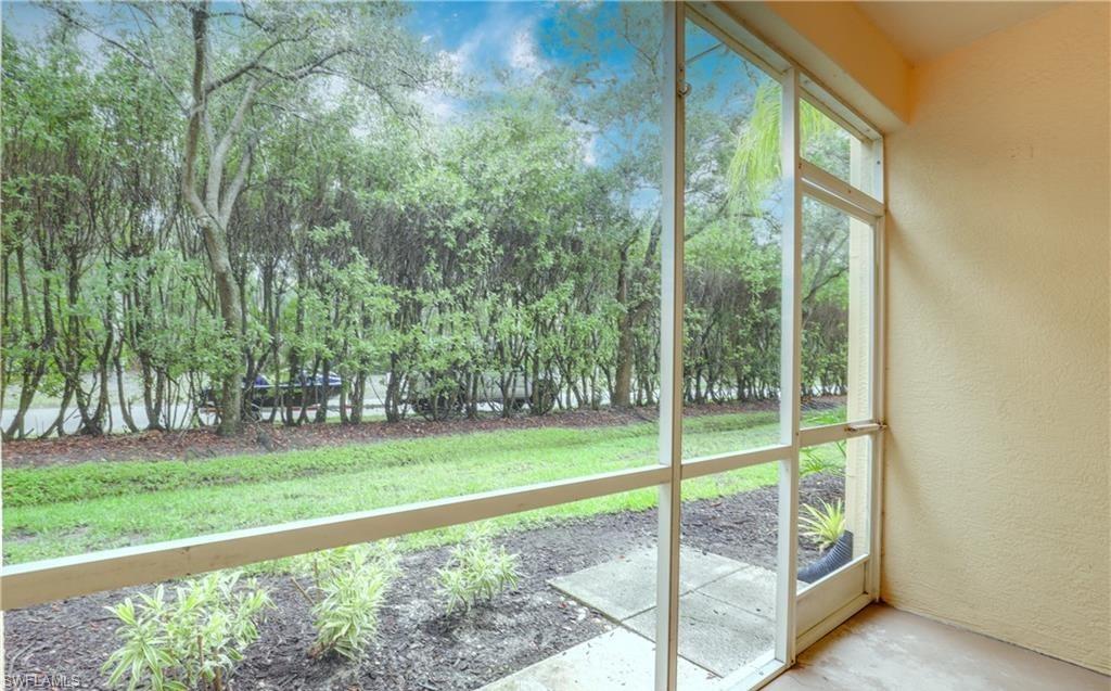 4635 St Croix Lane, Unit 1215 Naples, FL 34109 - Photo 18 of 22 a view of a park with large trees
