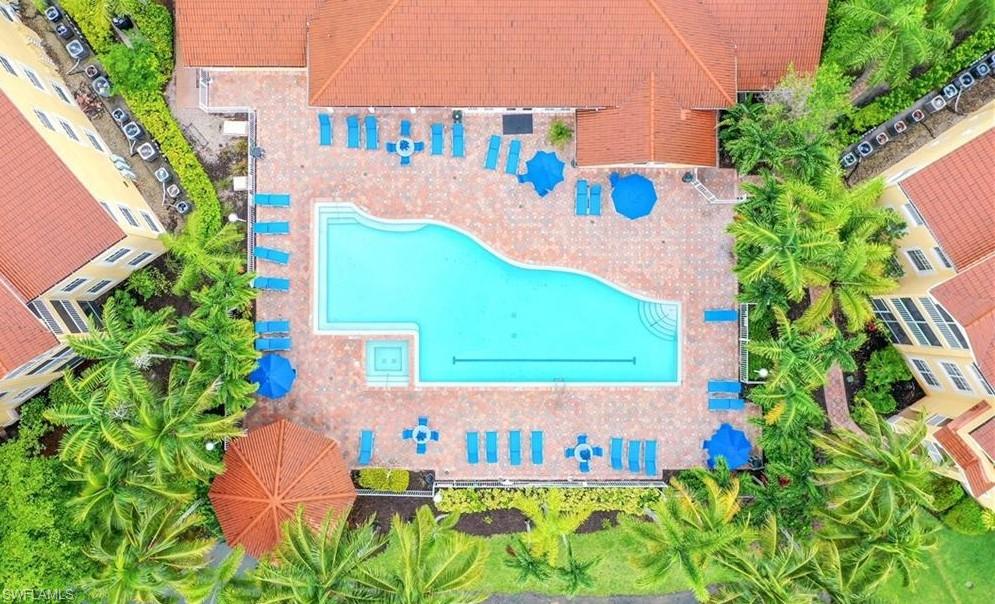 4635 St Croix Lane, Unit 1215 Naples, FL 34109 - Photo 20 of 22 an sign that is in front of flowers