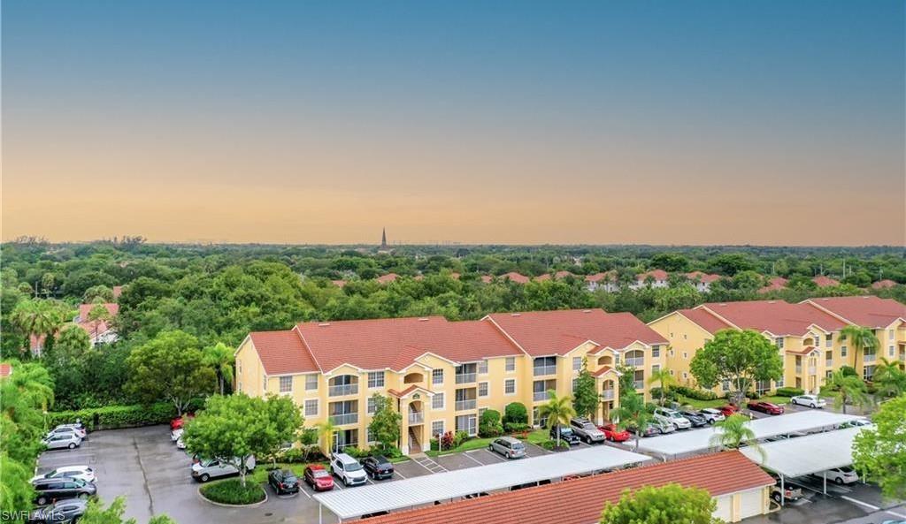 4635 St Croix Lane, Unit 1215 Naples, FL 34109 - Photo 22 of 22 an aerial view of residential houses and city street