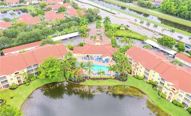 a view of house with outdoor space and swimming pool