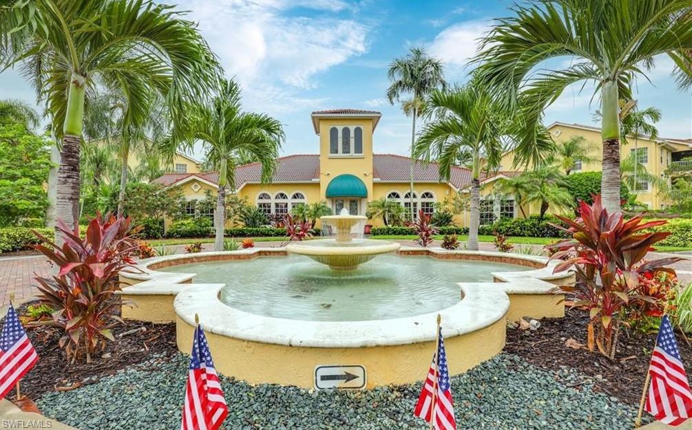 4635 St Croix Lane, Unit 1215 Naples, FL 34109 - Photo 3 of 22 a view of swimming pool with a table and chairs