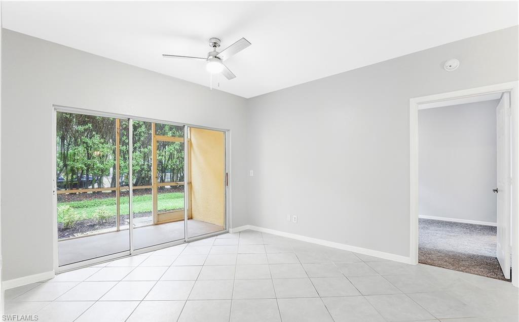 4635 St Croix Lane, Unit 1215 Naples, FL 34109 - Photo 6 of 22 a view of an empty room with a window