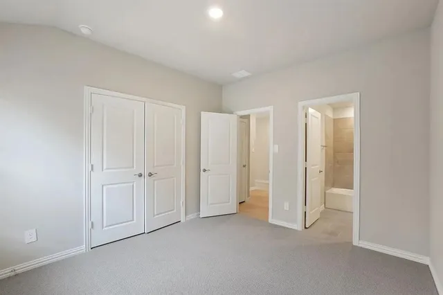 an empty room with a bathroom