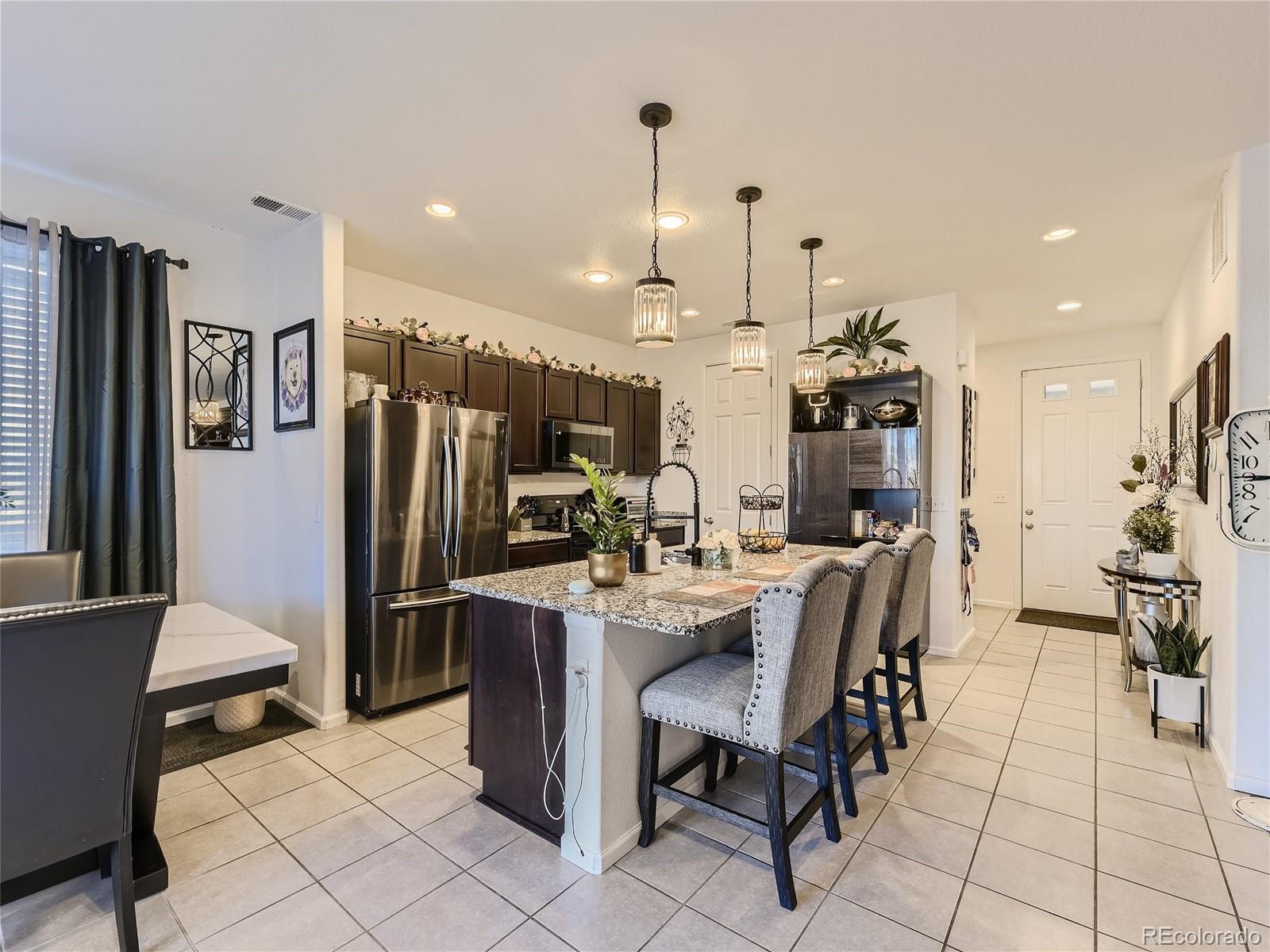 219 South Kellerman Street Aurora, CO 80018 - Photo 11 of 28 a view of a dining room with furniture