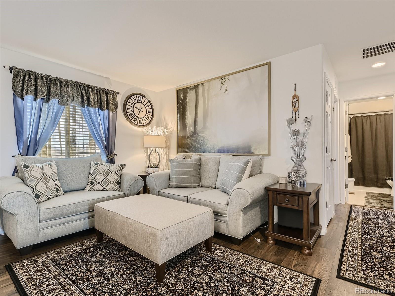 219 South Kellerman Street Aurora, CO 80018 - Photo 15 of 28 a living room with furniture and a large window