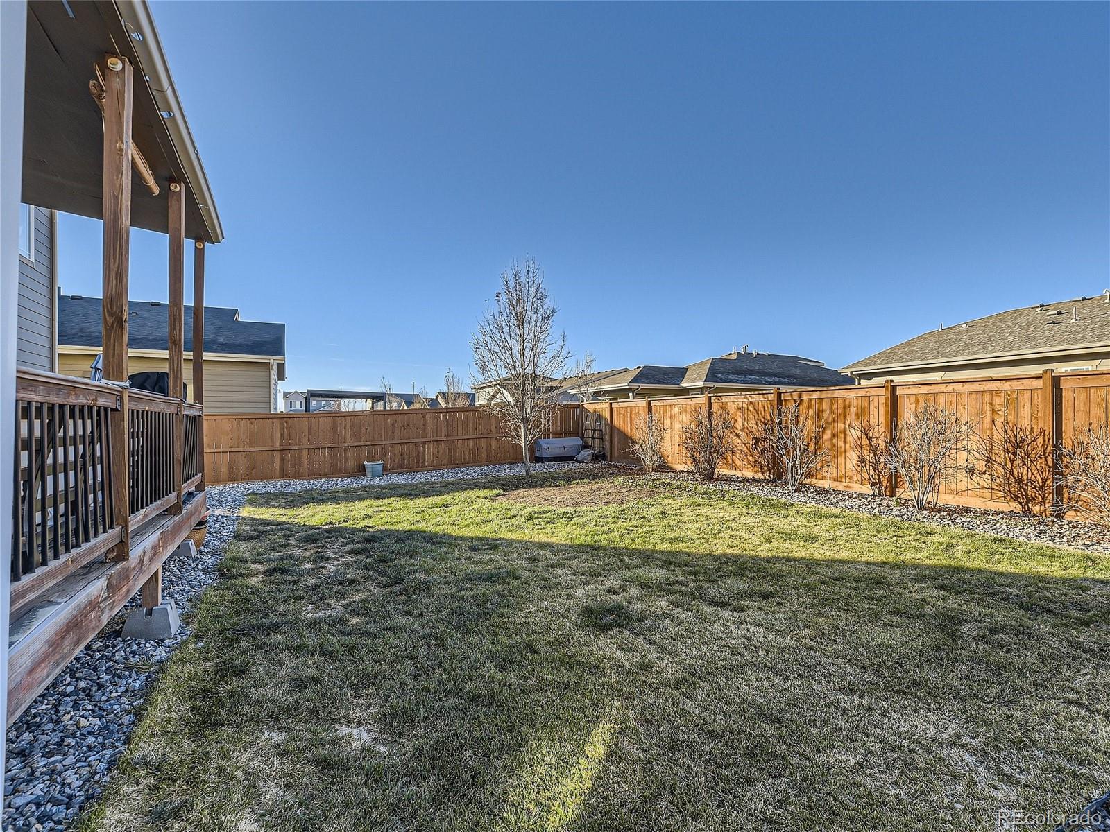 219 South Kellerman Street Aurora, CO 80018 - Photo 27 of 28 a view of a house with backyard and sitting area