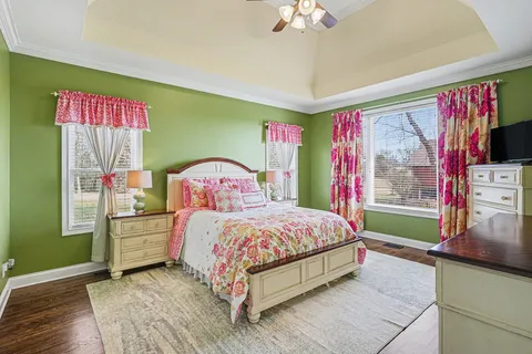 a bedroom with a bed and a dresser