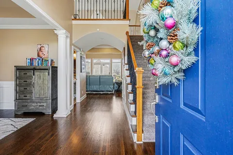 a view of living room with furniture and a fireplace