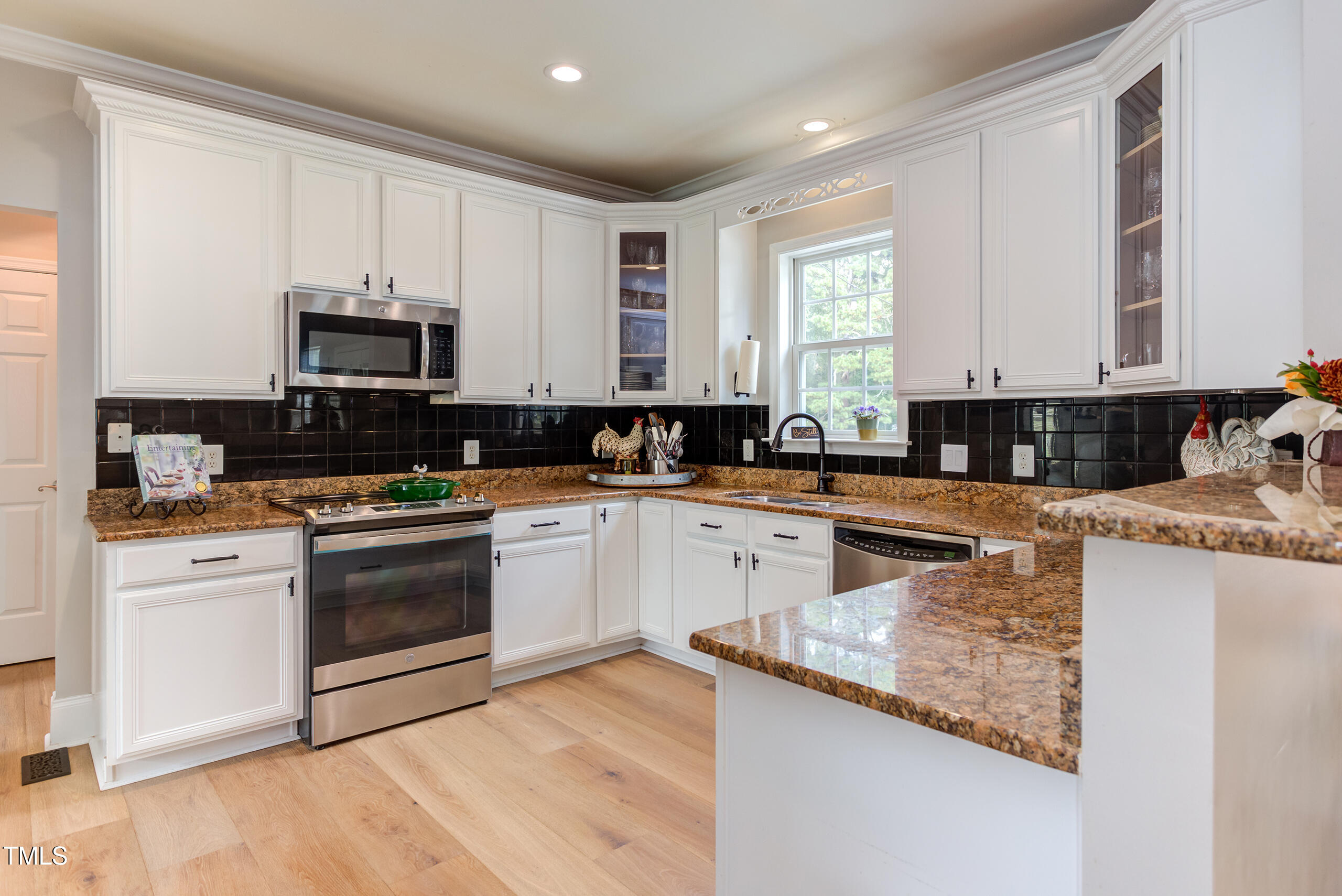 4191 Bobbitt Road Kittrell, NC 27544 - Photo 17 of 89 a kitchen with stainless steel appliances granite countertop a stove a sink and a microwave