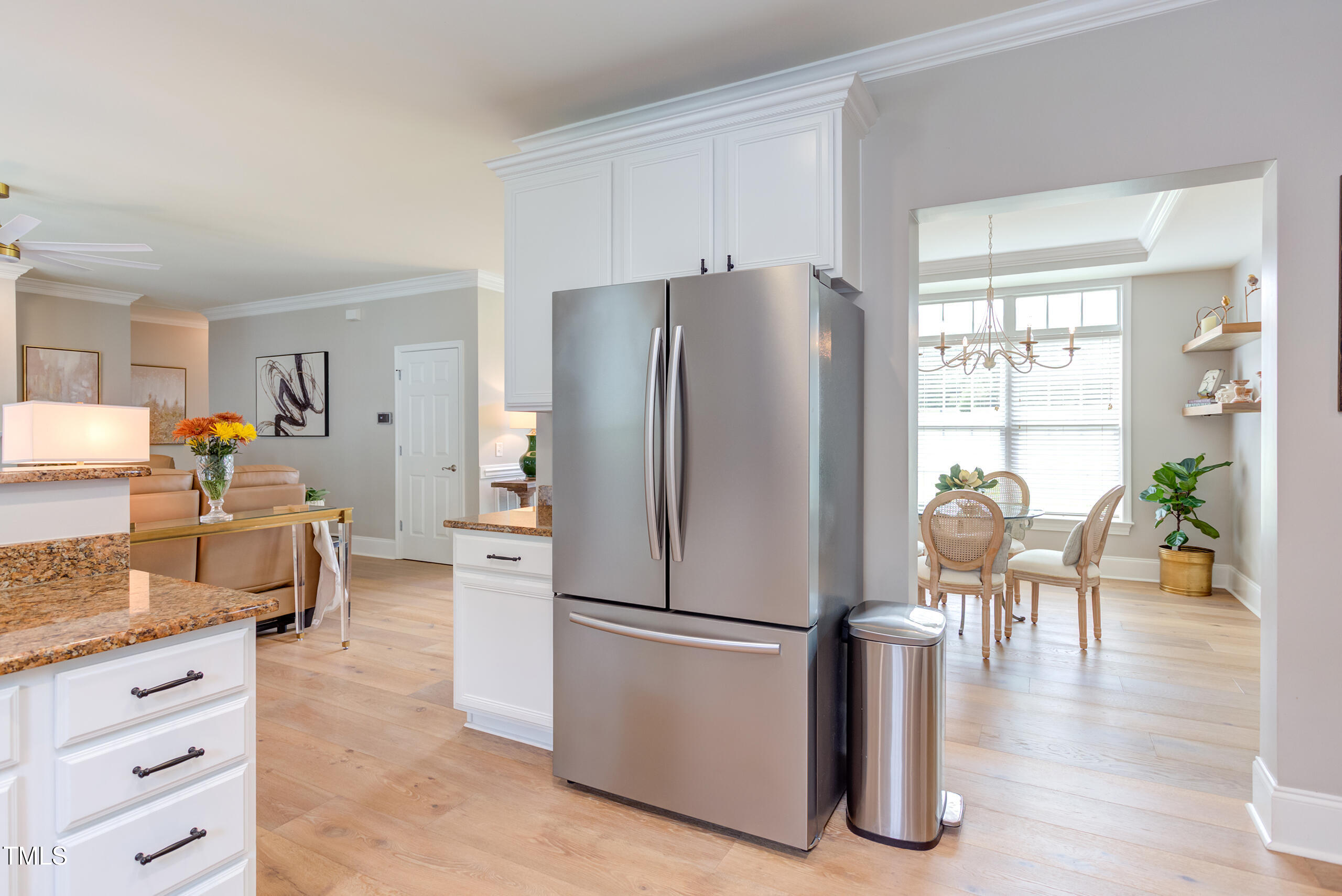 4191 Bobbitt Road Kittrell, NC 27544 - Photo 22 of 89 a kitchen with stainless steel appliances a refrigerator a stove a dining table and chairs with wooden floor