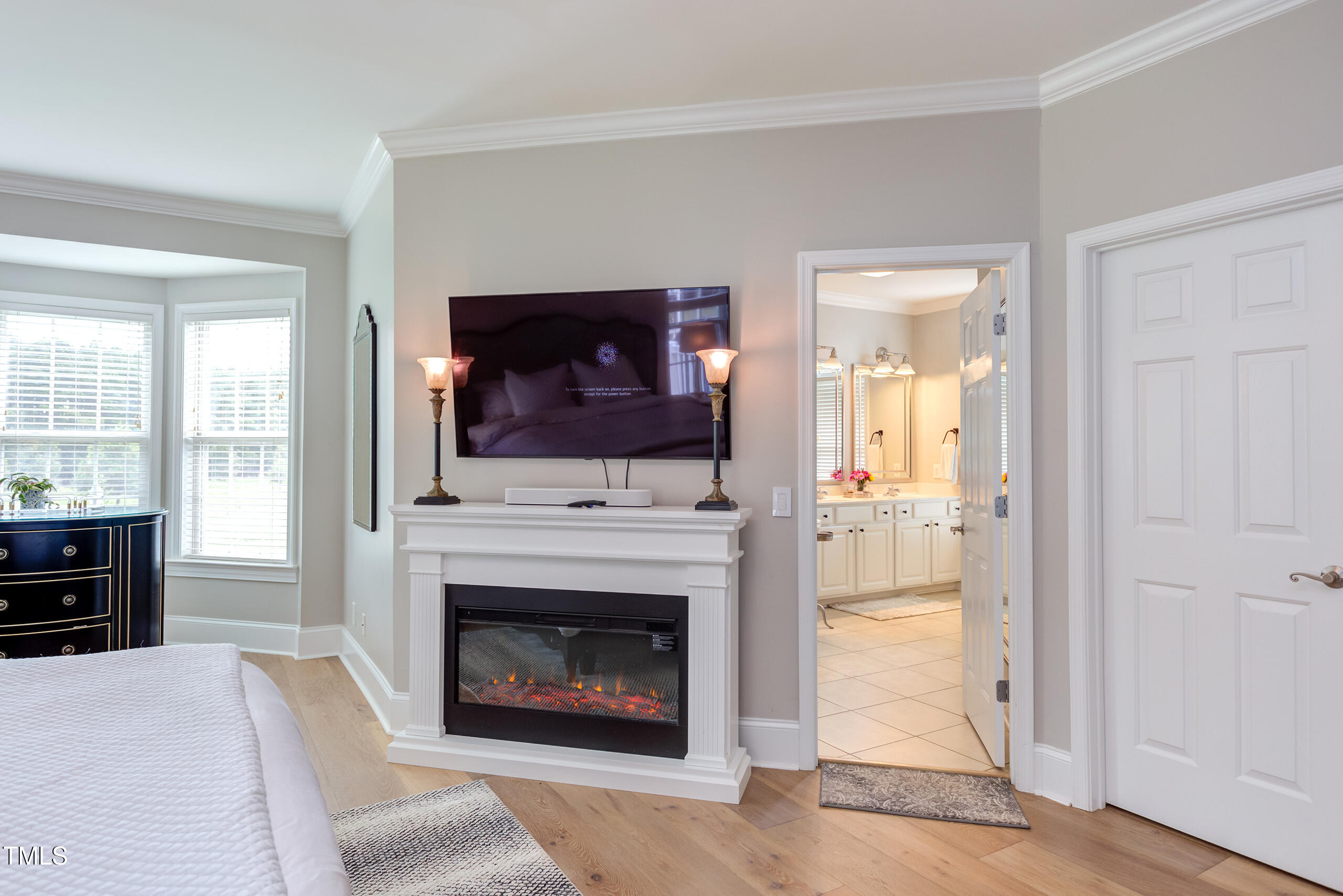 4191 Bobbitt Road Kittrell, NC 27544 - Photo 30 of 89 a living room with a fireplace and a flat screen tv