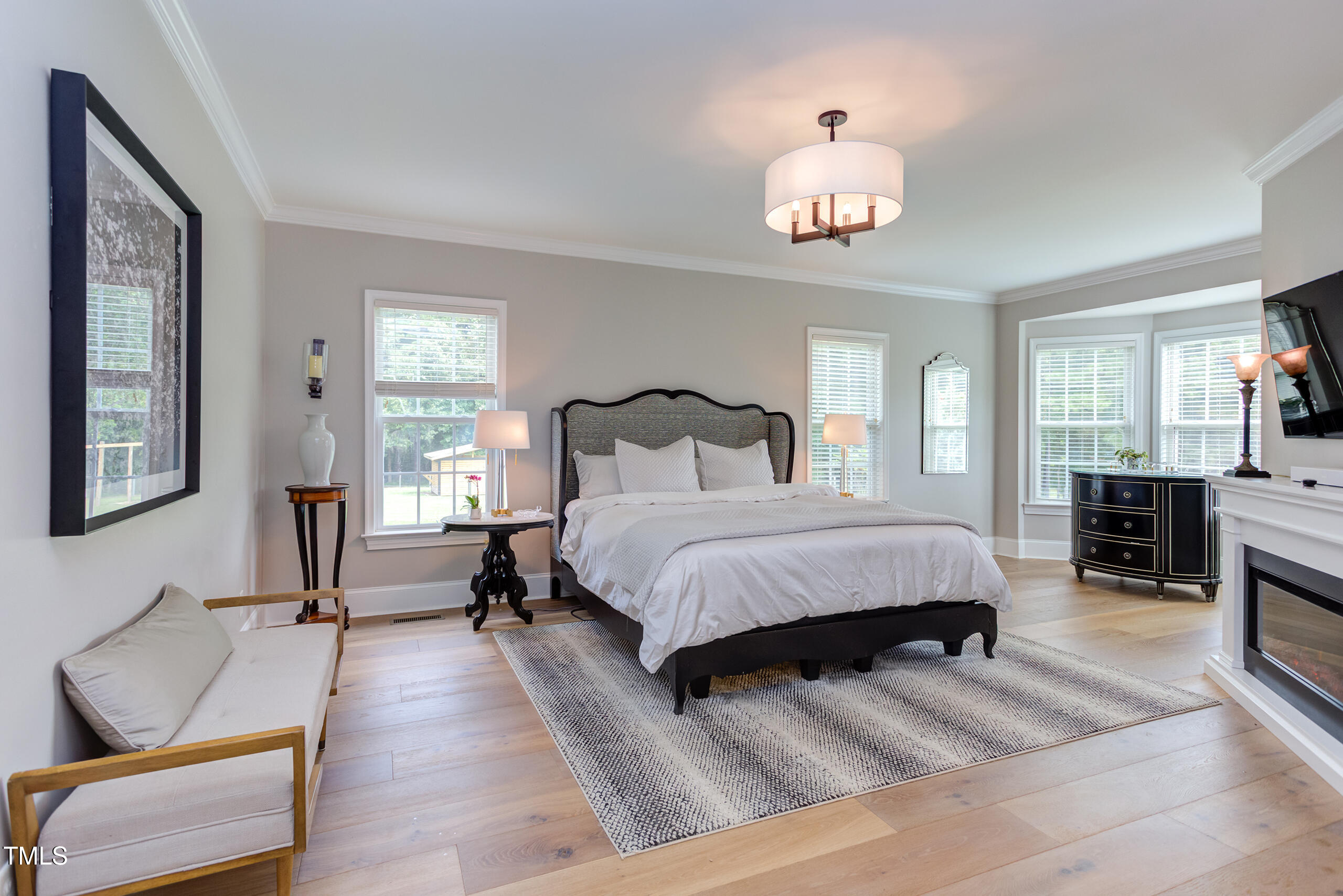 4191 Bobbitt Road Kittrell, NC 27544 - Photo 31 of 89 a bedroom with a bed and a chandelier