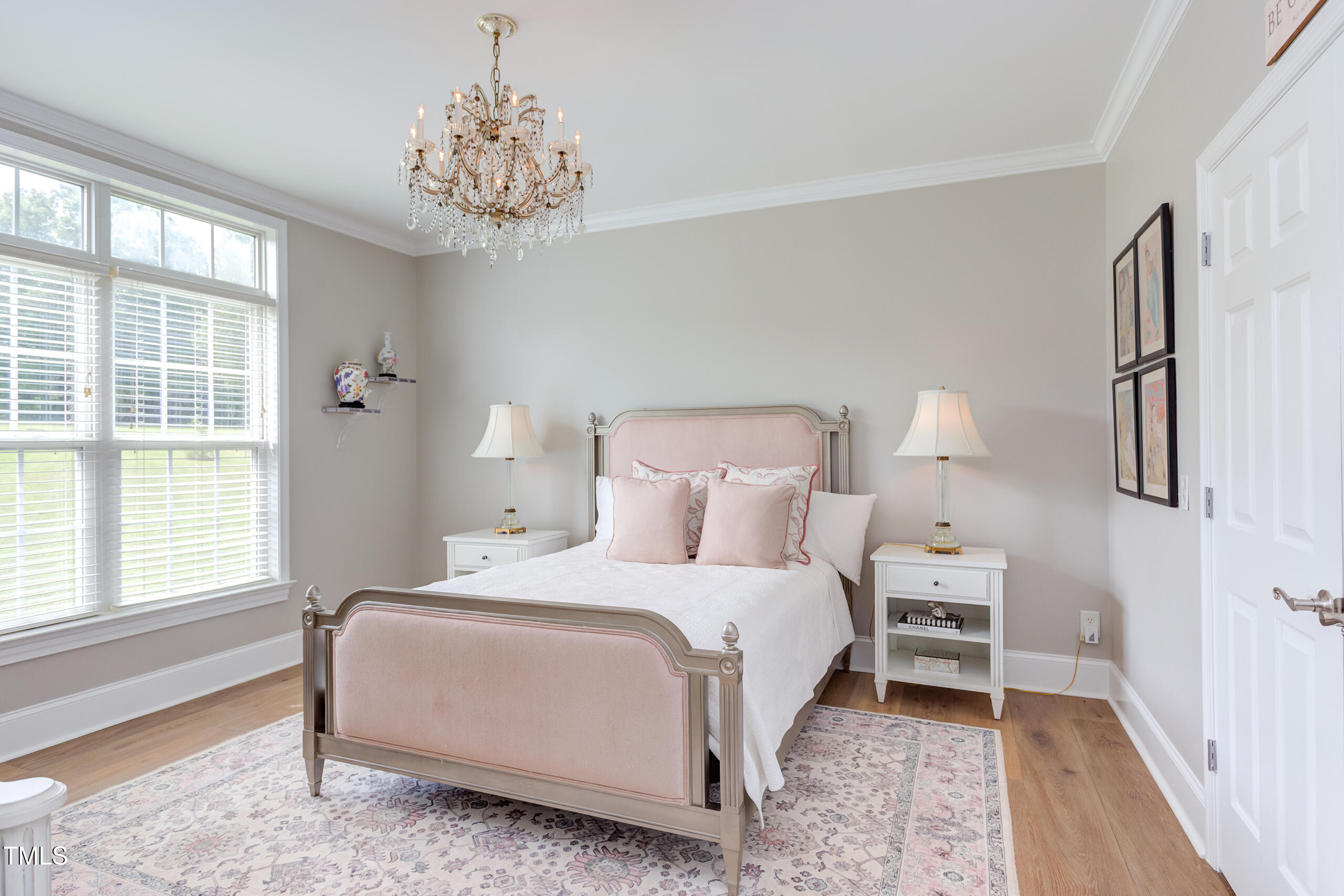 4191 Bobbitt Road Kittrell, NC 27544 - Photo 39 of 89 a bedroom with a bed and a chandelier