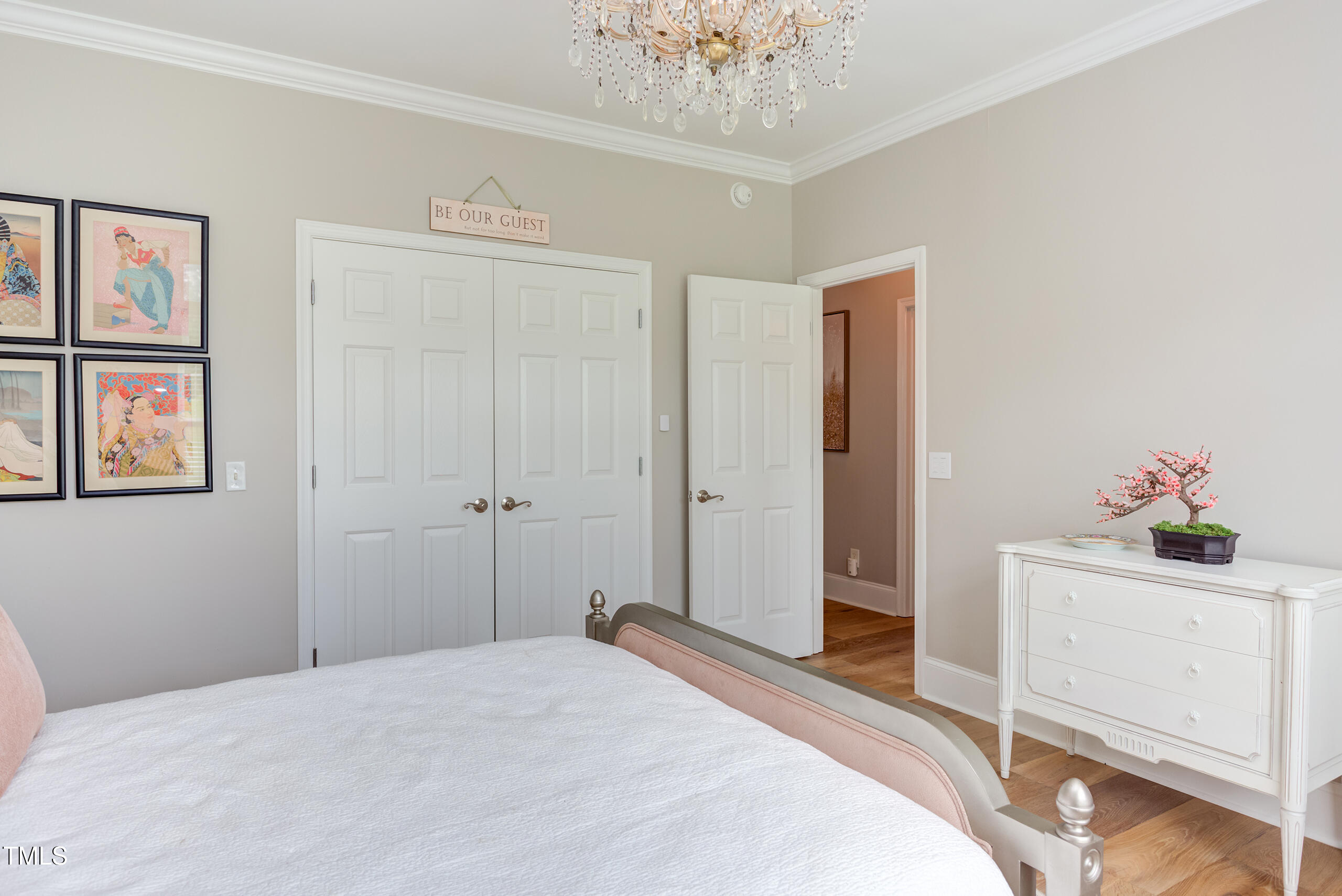 4191 Bobbitt Road Kittrell, NC 27544 - Photo 42 of 89 a bedroom with a bed and a chandelier