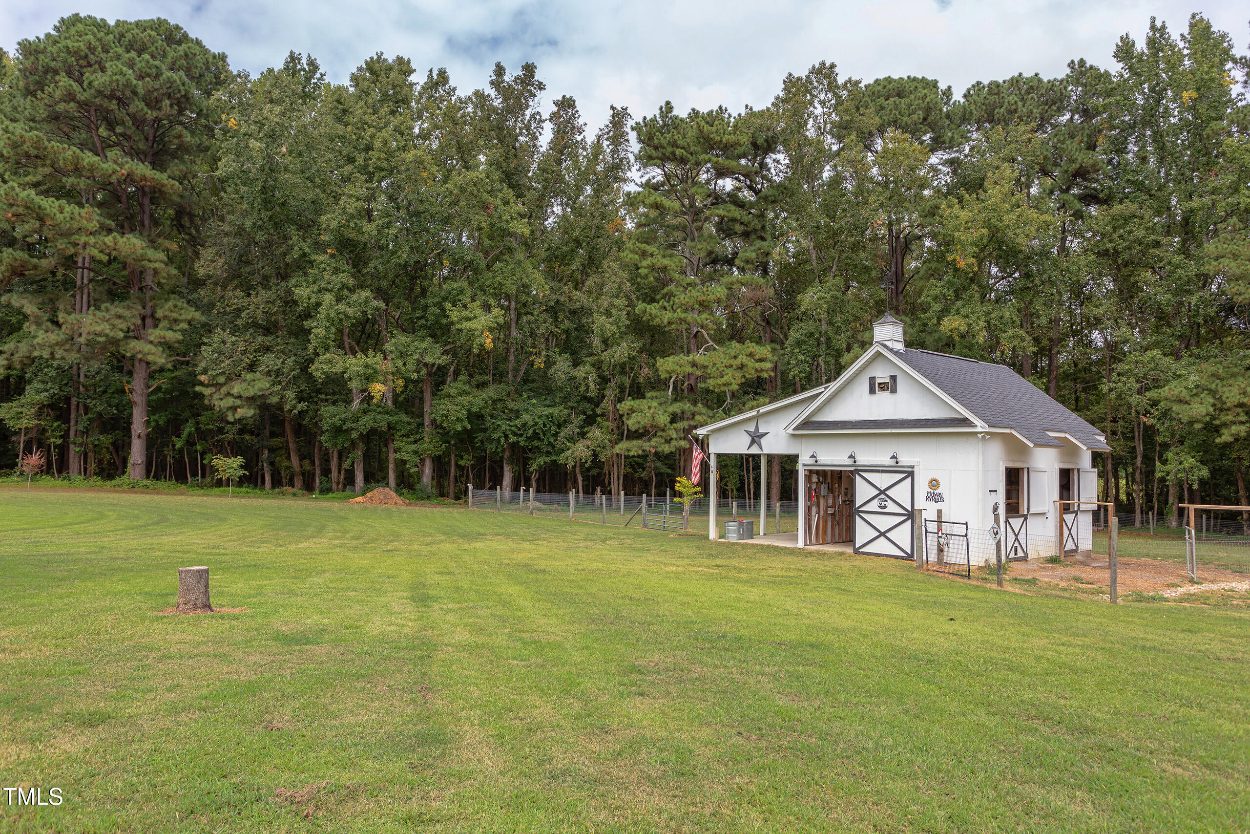 4191 Bobbitt Road Kittrell, NC 27544 - Photo 56 of 89 a front view of a house with a garden and trees
