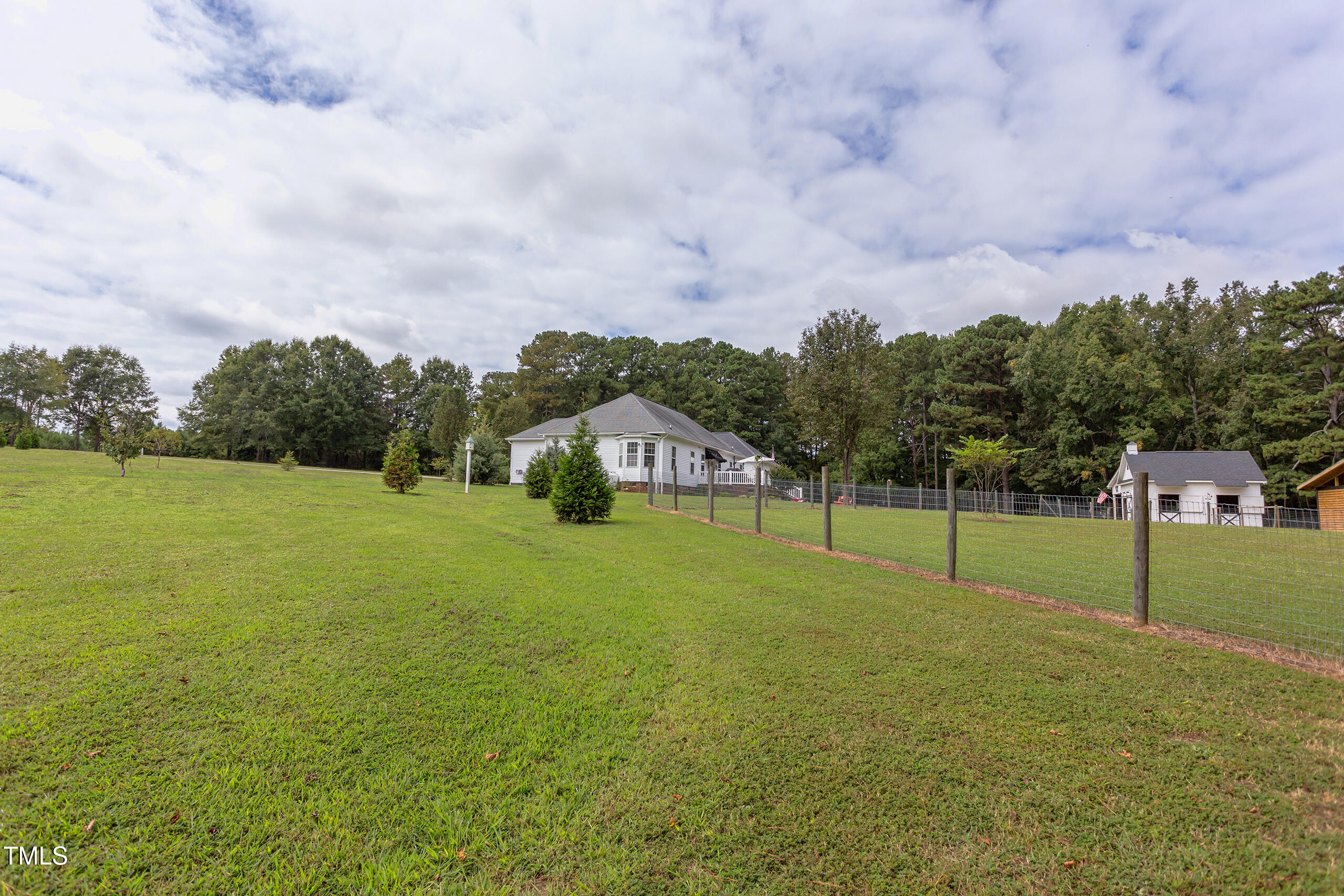 4191 Bobbitt Road Kittrell, NC 27544 - Photo 64 of 89 a house view with swimming pool and trees in the background
