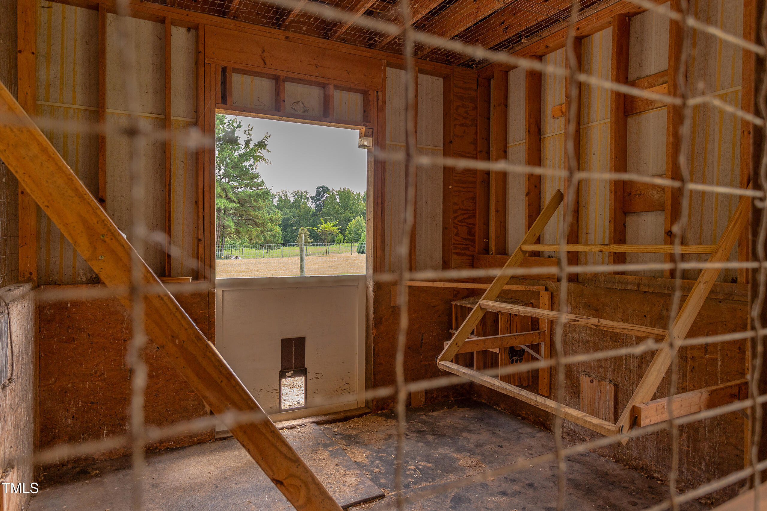 4191 Bobbitt Road Kittrell, NC 27544 - Photo 72 of 89 a view of an empty room with wooden floor and windows