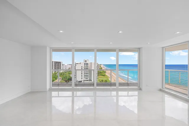 a kitchen with stainless steel appliances granite countertop a sink window and cabinets