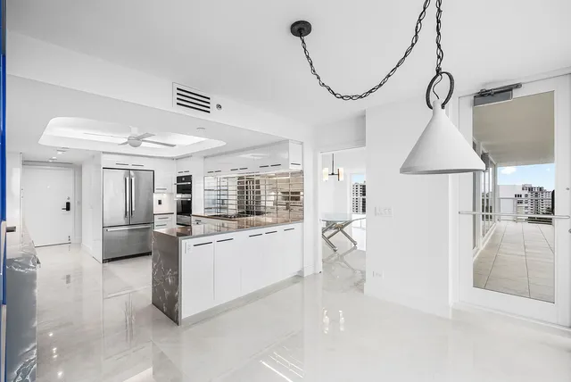 a view of an empty room and a window