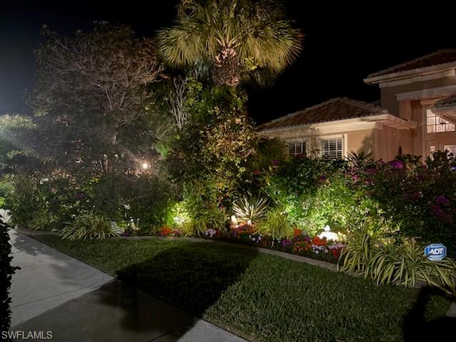 7838 Founders Circle Naples, FL 34104 - Photo 2 of 31 a view of a back yard of the house