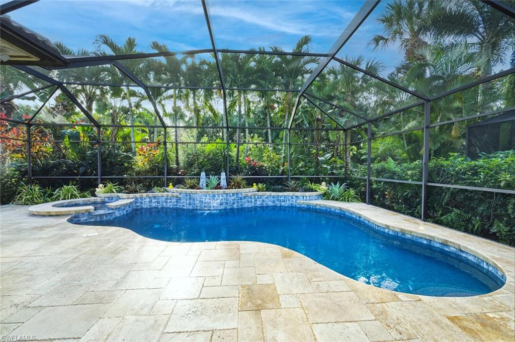 7838 Founders Circle Naples, FL 34104 - Photo 29 of 31 a view of a swimming pool with a patio