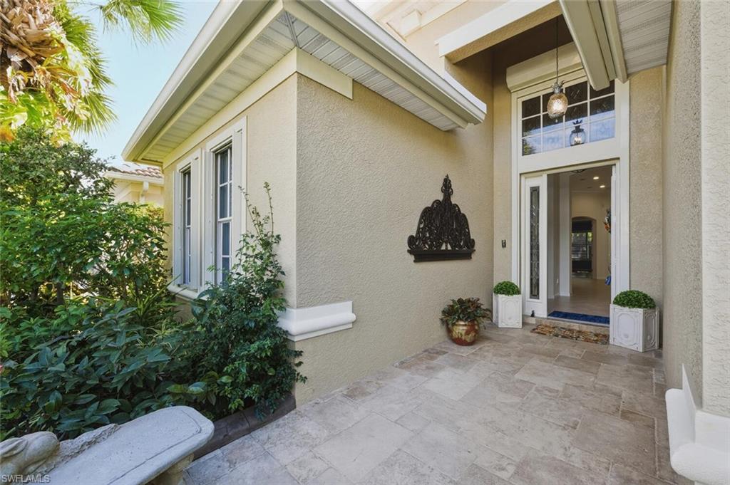7838 Founders Circle Naples, FL 34104 - Photo 4 of 31 a view of a house with a backyard