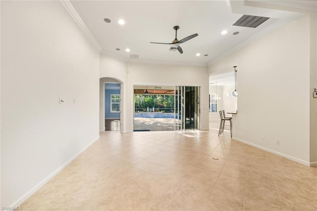 7838 Founders Circle Naples, FL 34104 - Photo 5 of 31 a view of a livingroom with a ceiling fan and window