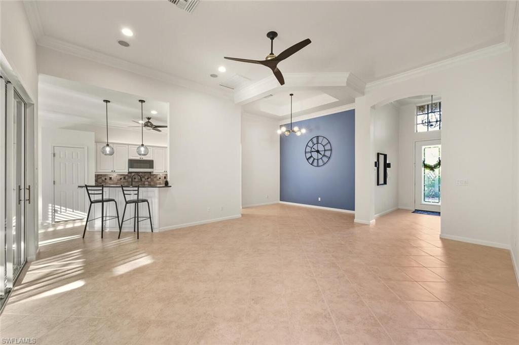 7838 Founders Circle Naples, FL 34104 - Photo 6 of 31 a view of a livingroom with furniture and a ceiling fan