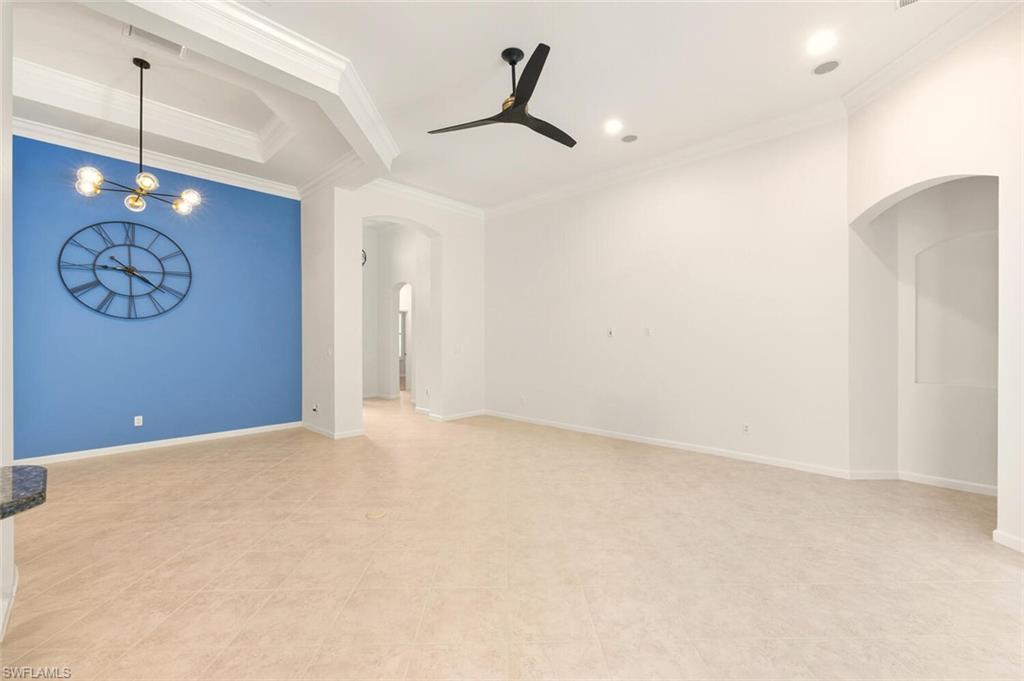 7838 Founders Circle Naples, FL 34104 - Photo 9 of 31 a view of an empty room with window and cabinet