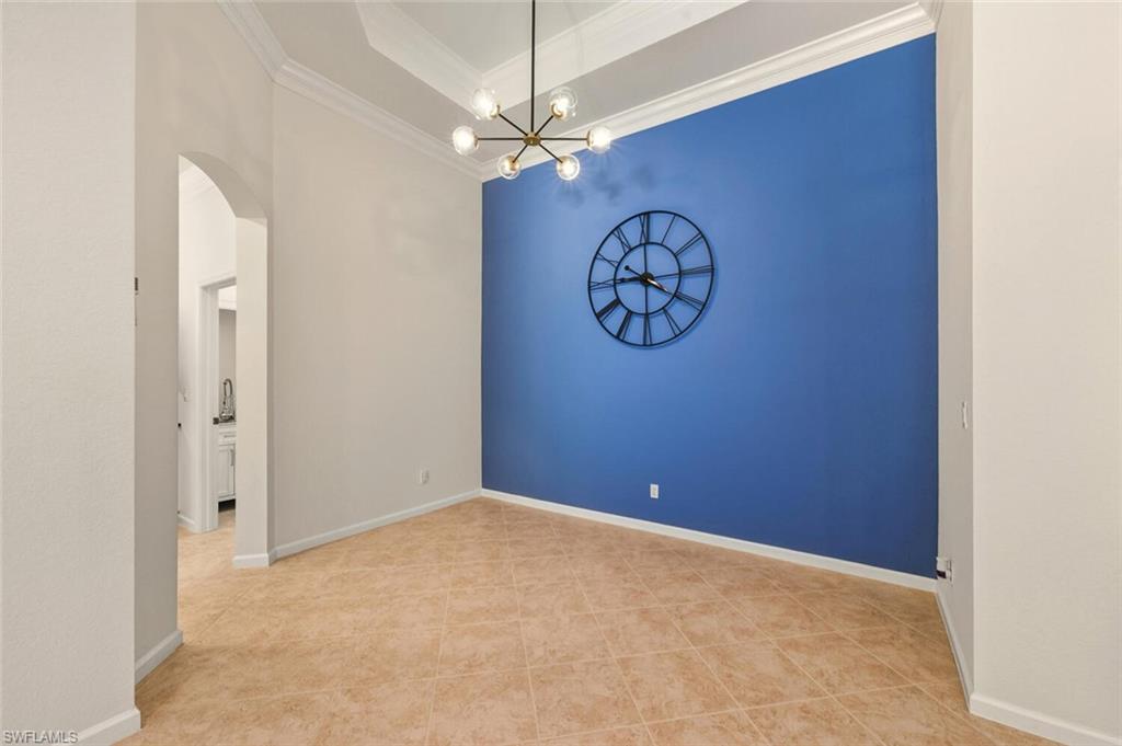 7838 Founders Circle Naples, FL 34104 - Photo 10 of 31 a view of a hallway with paintings on the wall