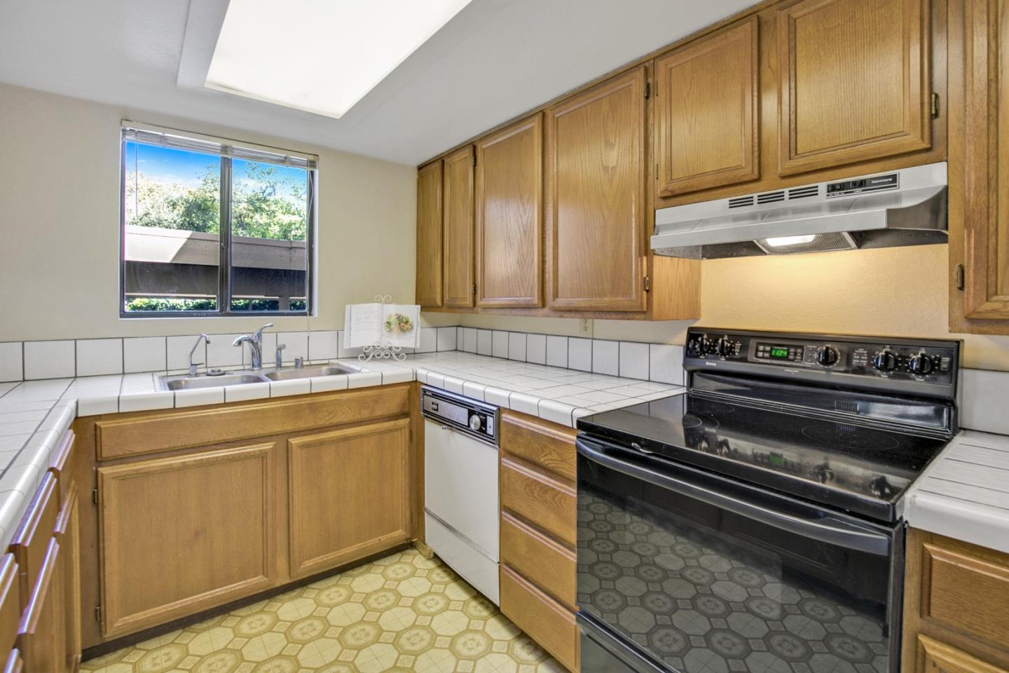 20 Seacliff Drive Aptos, CA 95003 - Photo 12 of 38 a kitchen with a sink stove and cabinets