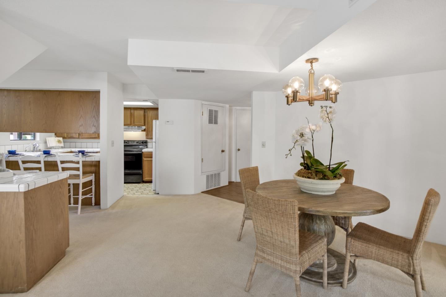 20 Seacliff Drive Aptos, CA 95003 - Photo 13 of 38 a view of a dining room with furniture and chandelier